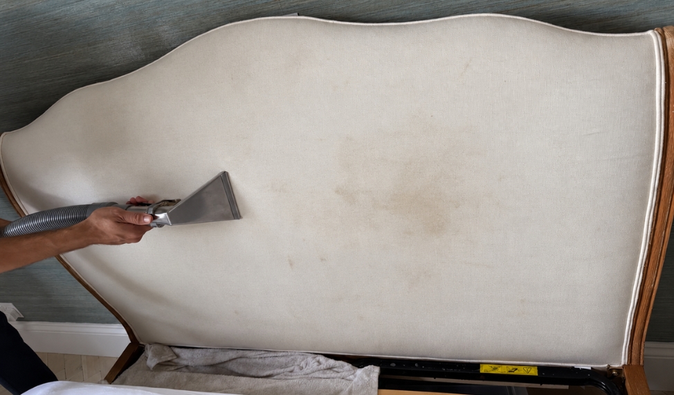 Fabric headboard before professional cleaning with visible staining